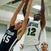 Arbor Prep Kjani Reed and Rudolf Steiner Peter Larsen jump for a rebound in the game on Tuesday, Jan. 22. The Gators lead at halftime 39-33. Daniel Brenner I AnnArbor.com